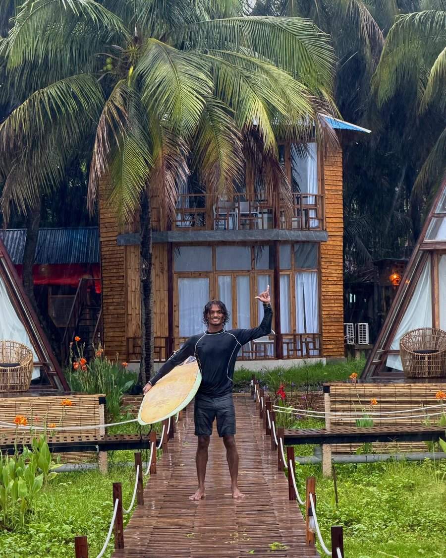 Jahed back from a surf at the guesthouse