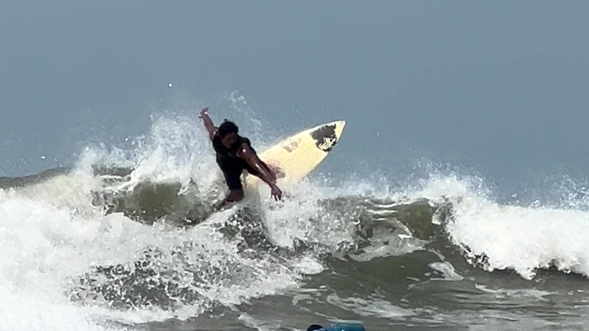 A local surfer on a Cox's Bazar wave